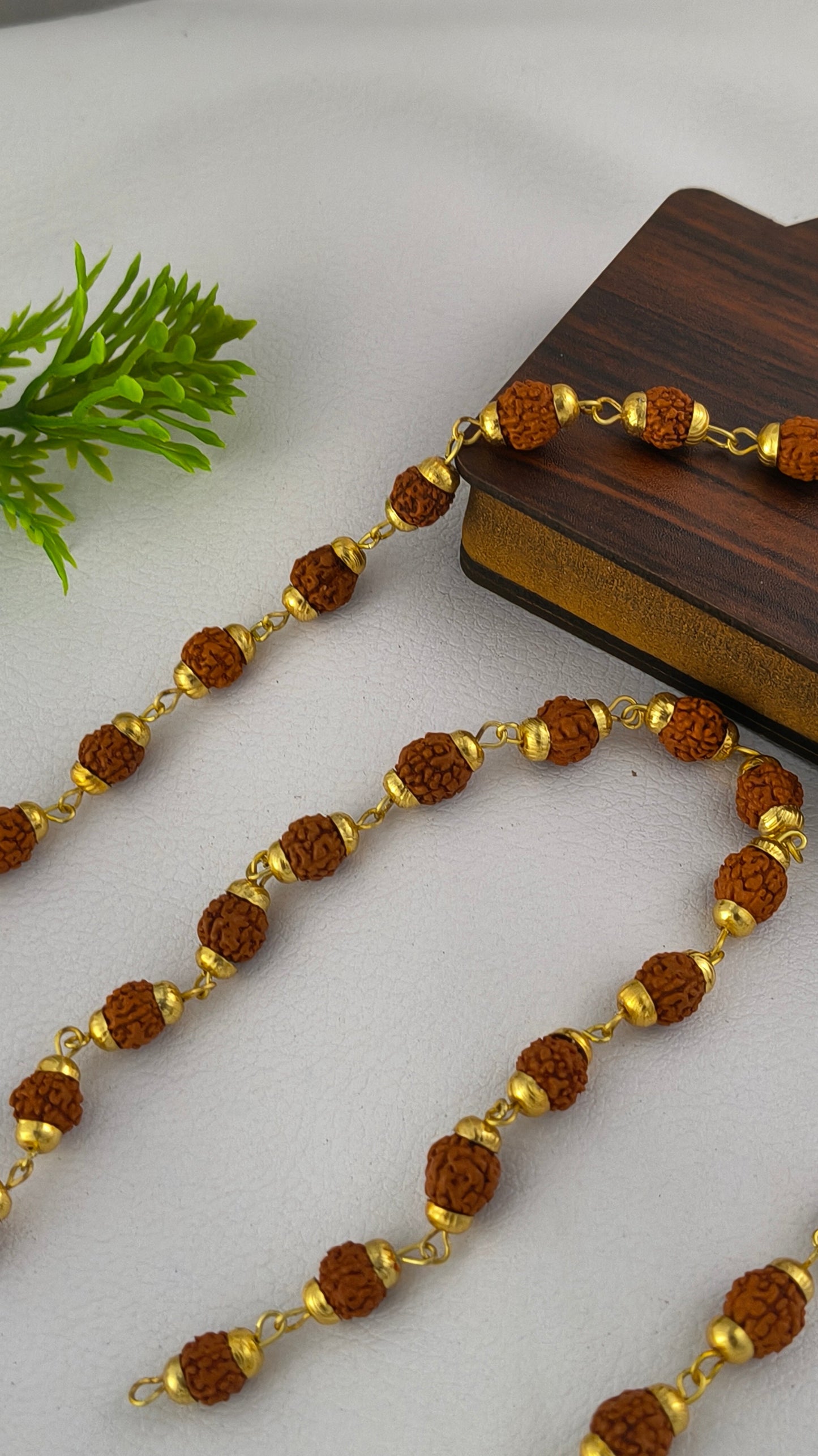Brown 7mm Rudraksh Mala Gold Plated.
