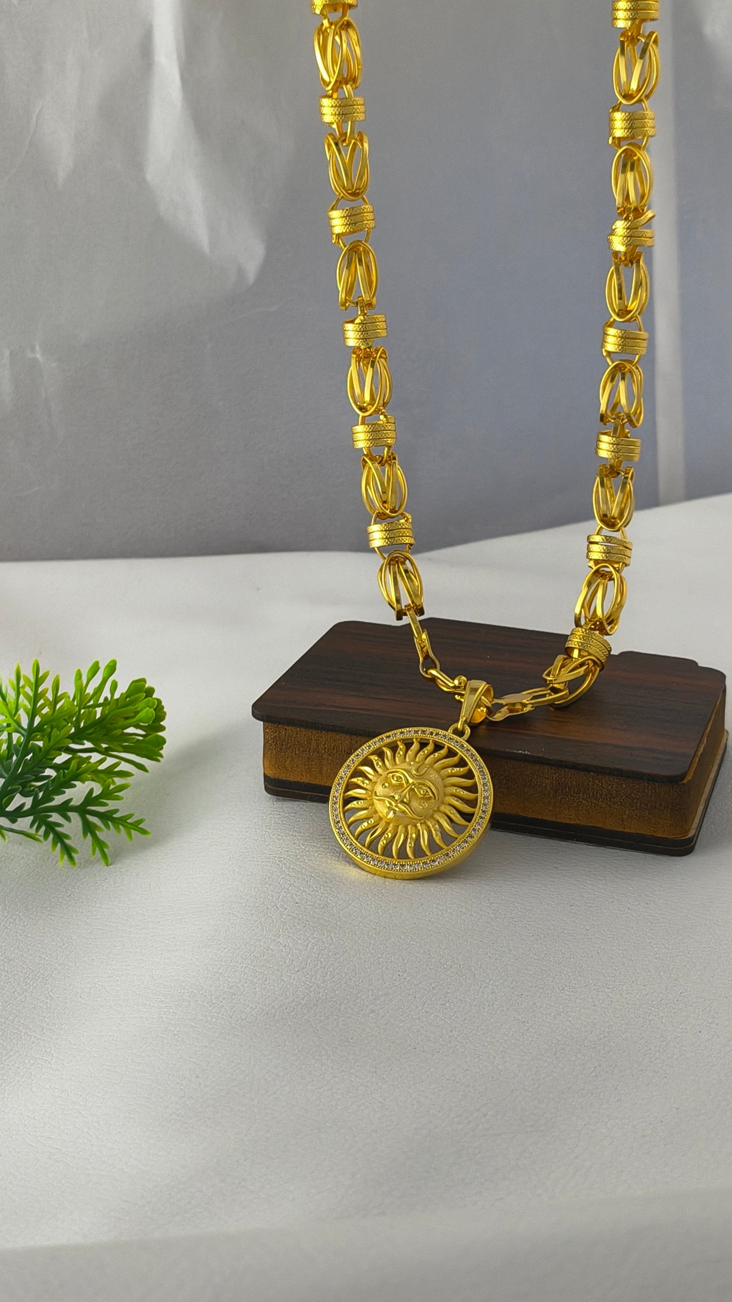 Gold plated premium heavy chain with surya pendant.
