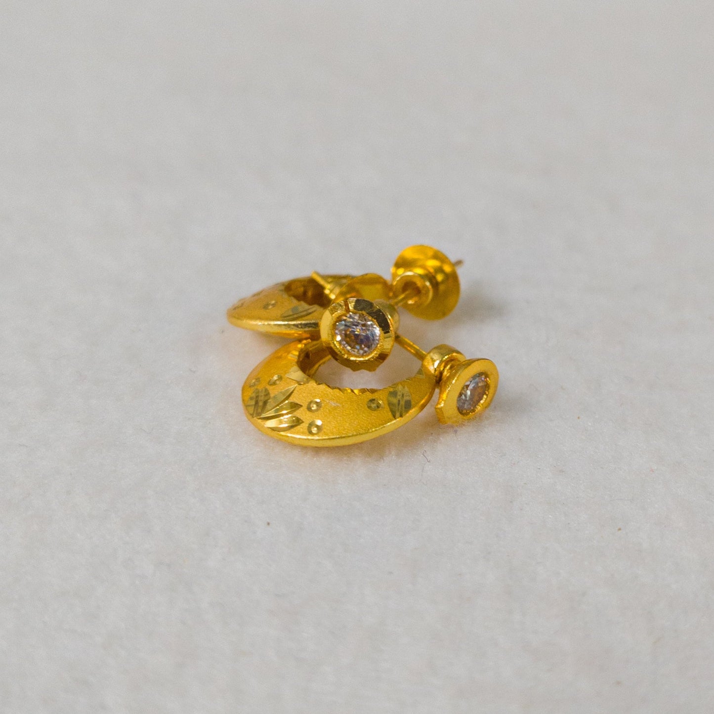 One Gram Gold Plated crescent moon stud earrings for men.